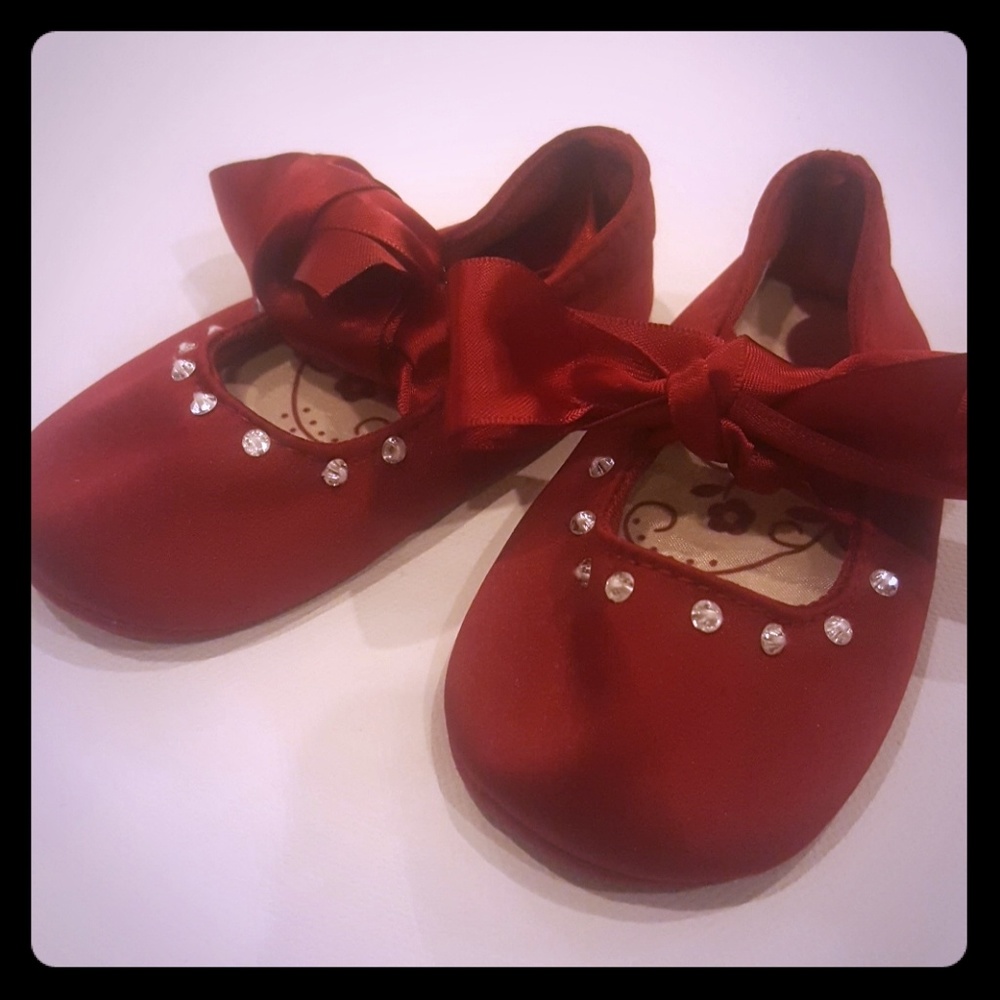 Red satin baby shoes
